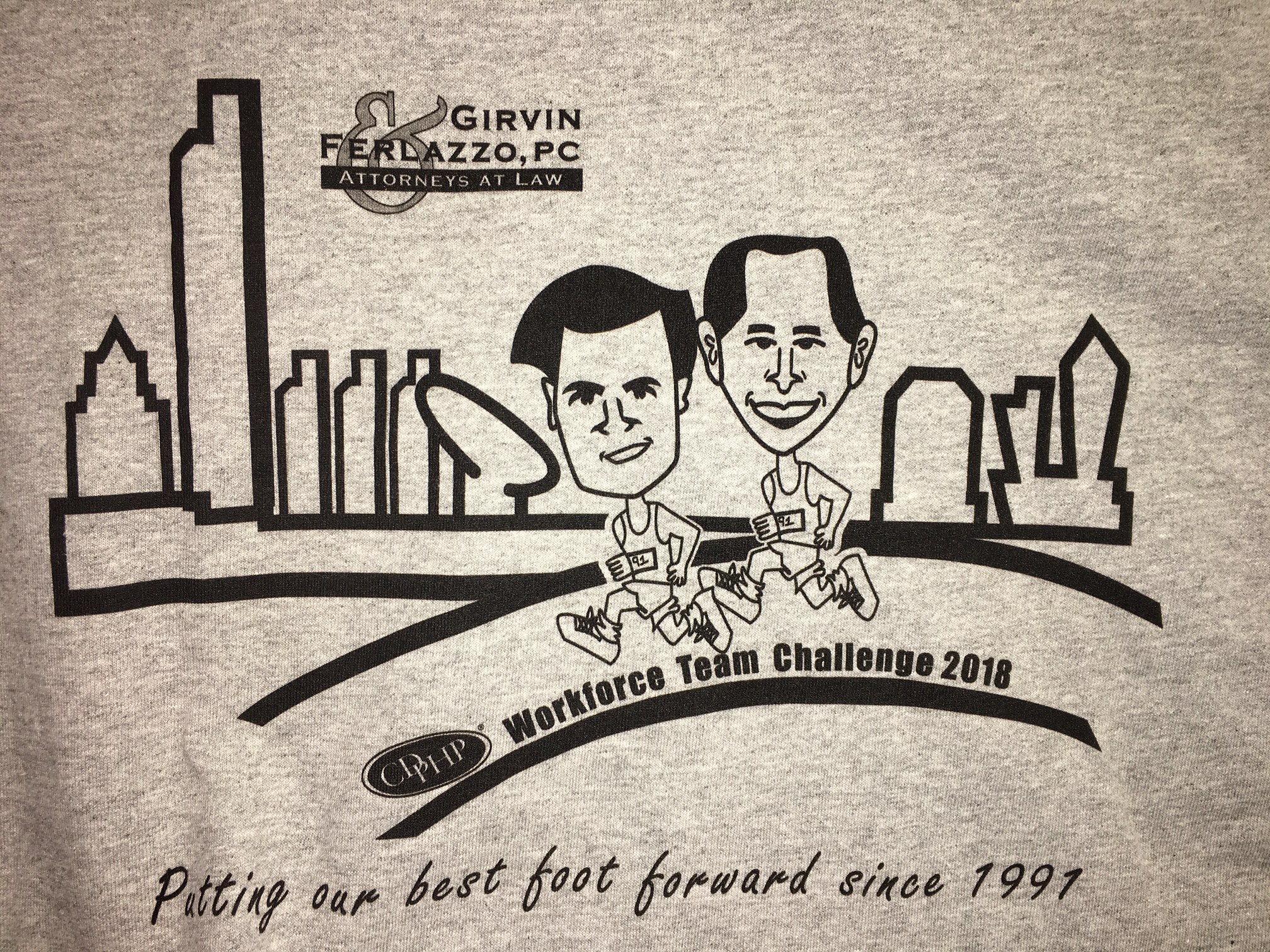 A t-shirt designed by a Girvin & Ferlazzo legal assistant reads, "putting our best foot forward since 1991"